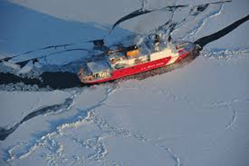 Icebraker sailing through ice in the arctic