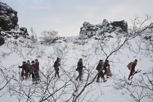 Yule Lads walking in the snow
